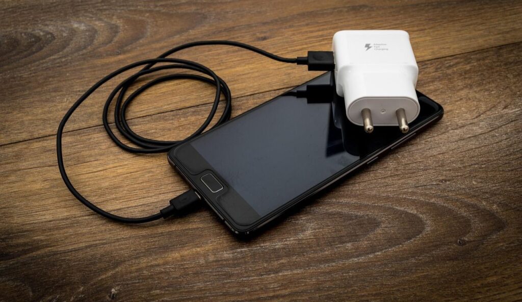 A universal adapter and a short charging cable backup