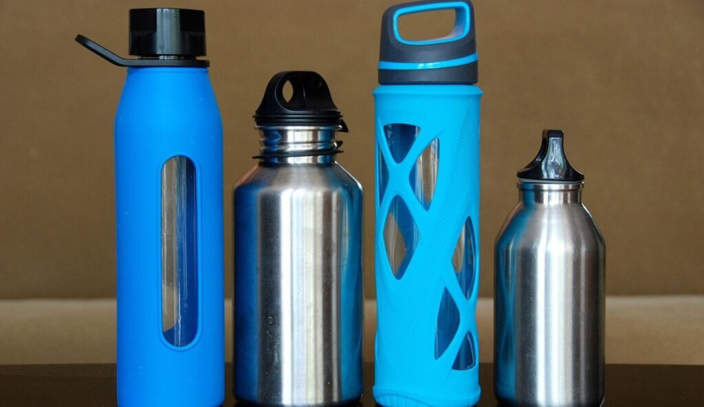A reusable water bottle and a small snack stash