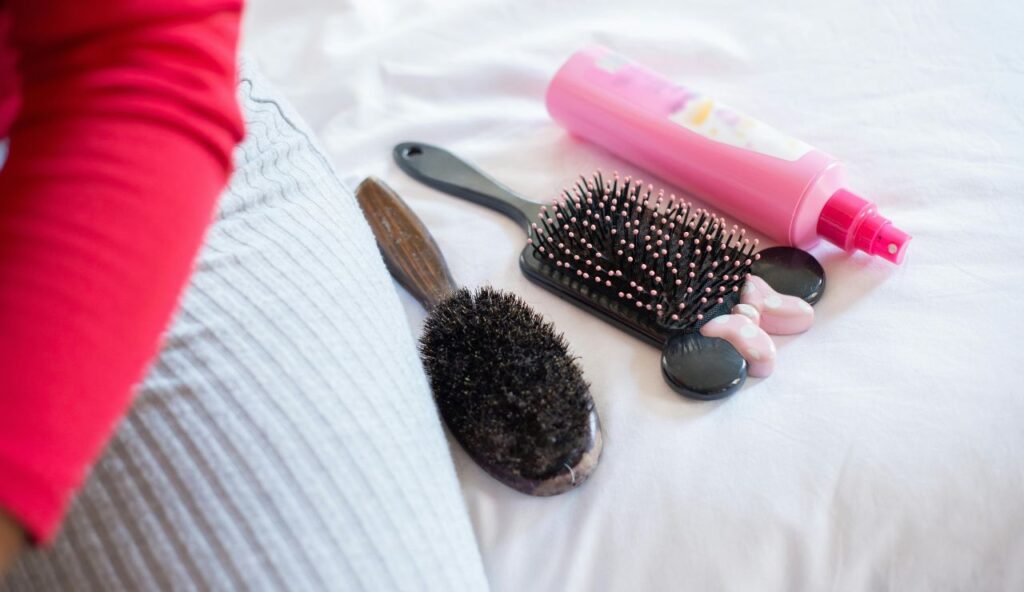 A hair plan: ties, clips, a mini brush, and humidity control