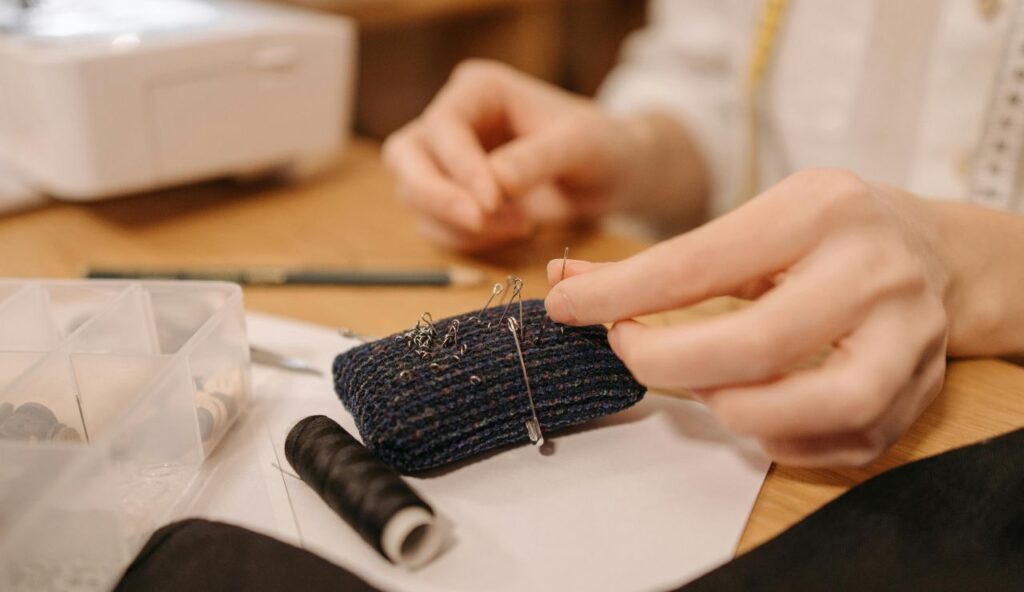 A stain remover pen and a tiny sewing kit for outfit saves